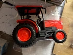 7"LONG New Ray Orange Kubota L6060 Tractor , No Packaging # Used. Price: $9.50.