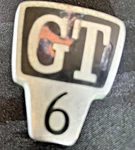 Triumph GT6 MK.1 Rear Body Emblem 619860 Used. Price: $8.00.