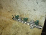 Suzuki DF60A 60HP Outboard Fuel Rail And Injector Set (15710-88L00) Used. Price: $175.00.